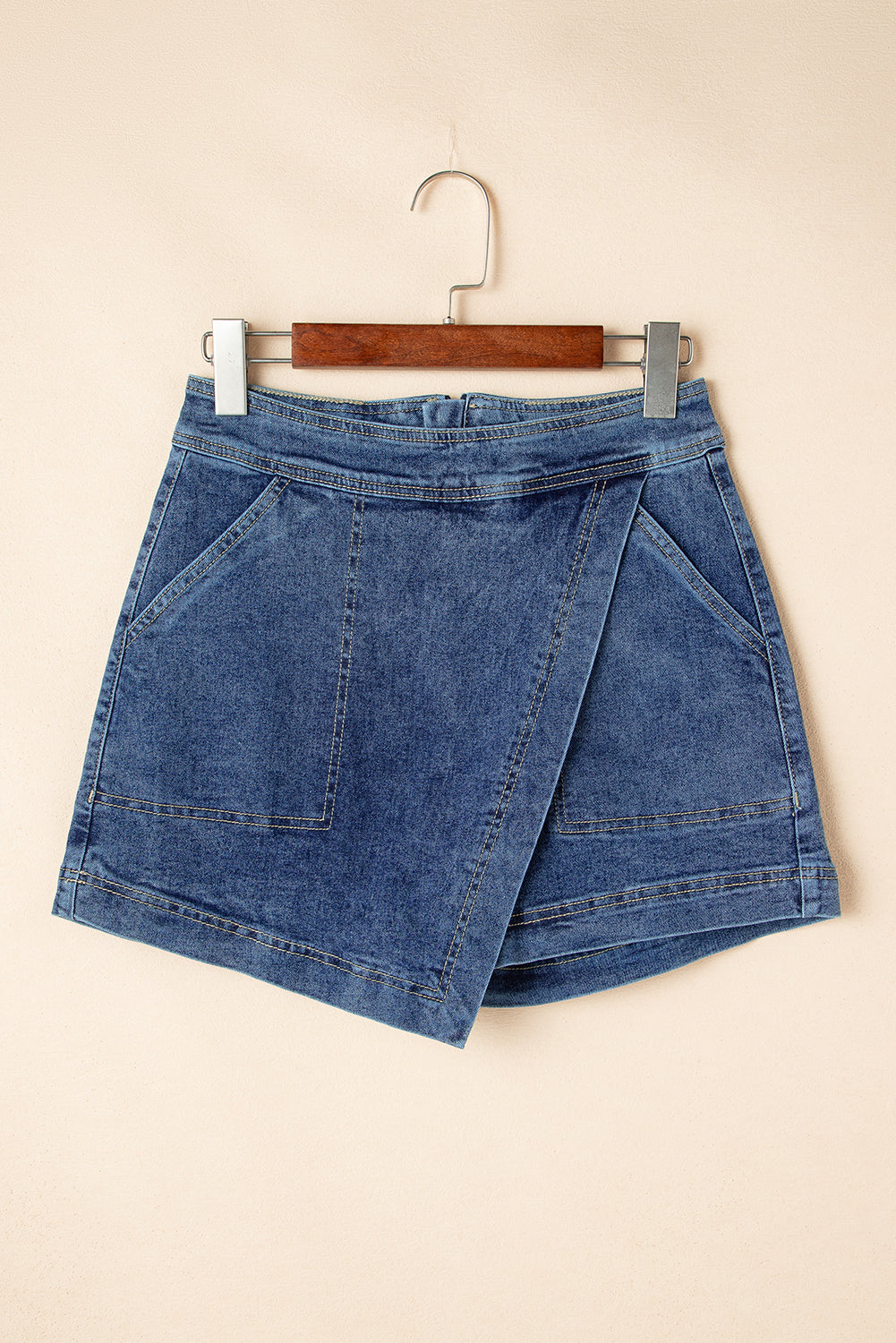 Ashleigh Blue Faux-Wrapped Mini Denim Skort for women from 6i6.com, a trendy and versatile summer piece.