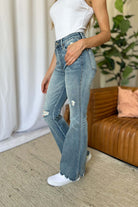 Judy Blue full-size medium rise tummy control destroy flare jeans with a flattering fit and distressed details, available at 6i6.com