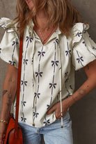 Bow Print Tie Neck Short Sleeve Blouse for women from 6i6.com, a stylish and versatile top for casual or office wear.
