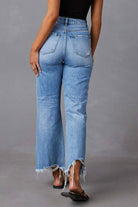 Distressed raw hem jeans with pockets, featuring a trendy frayed edge and a casual, stylish look, available at 6i6.com