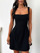Devine bow back square neck mini dress with a chic and playful design, perfect for any occasion, available at 6i6.com