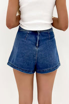 Ashleigh Blue Faux-Wrapped Mini Denim Skort for women from 6i6.com, a trendy and versatile summer piece.