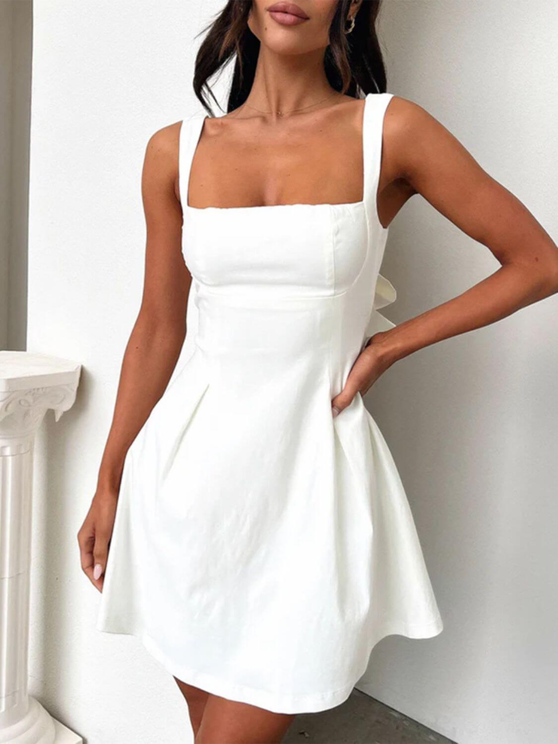 Devine bow back square neck mini dress with a chic and playful design, perfect for any occasion, available at 6i6.com
