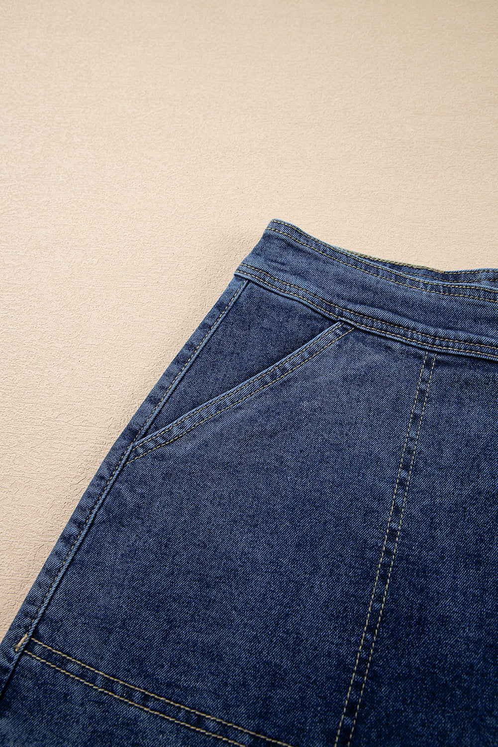 Ashleigh Blue Faux-Wrapped Mini Denim Skort for women from 6i6.com, a trendy and versatile summer piece.