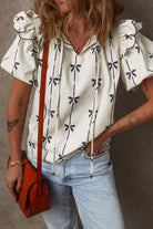 Bow Print Tie Neck Short Sleeve Blouse for women from 6i6.com, a stylish and versatile top for casual or office wear.