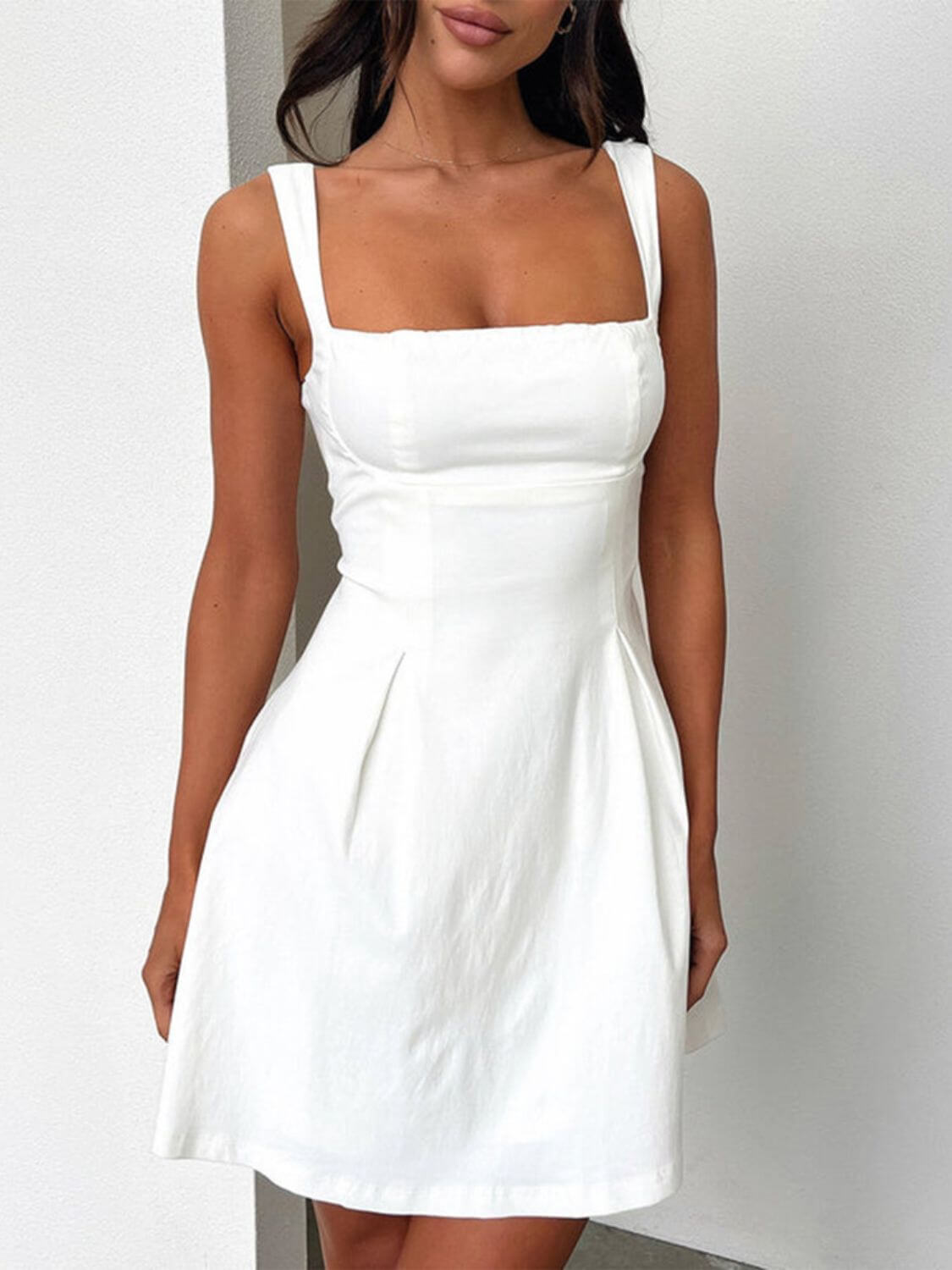 Devine bow back square neck mini dress with a chic and playful design, perfect for any occasion, available at 6i6.com