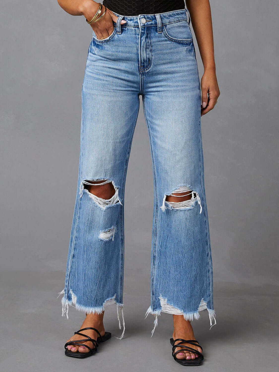 Distressed raw hem jeans with pockets, featuring a trendy frayed edge and a casual, stylish look, available at 6i6.com