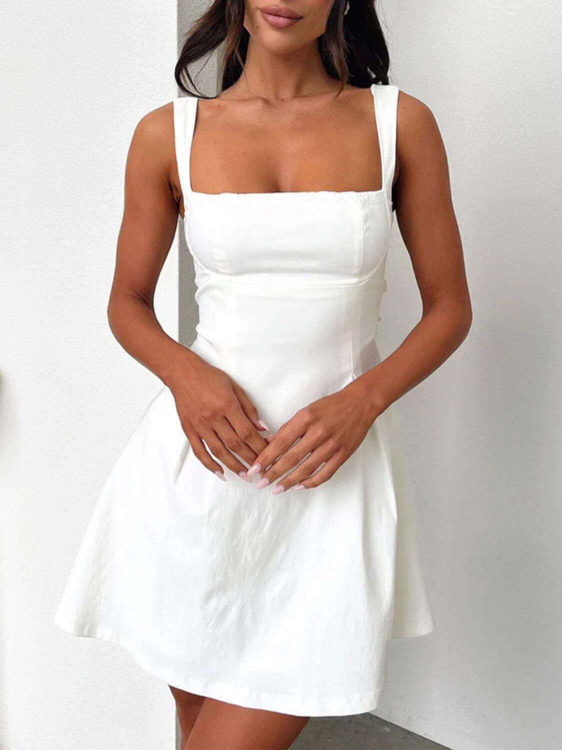 Devine bow back square neck mini dress with a chic and playful design, perfect for any occasion, available at 6i6.com