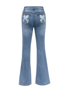 Bow back flare jeans with a feminine, playful design and a flattering fit, available at 6i6.com