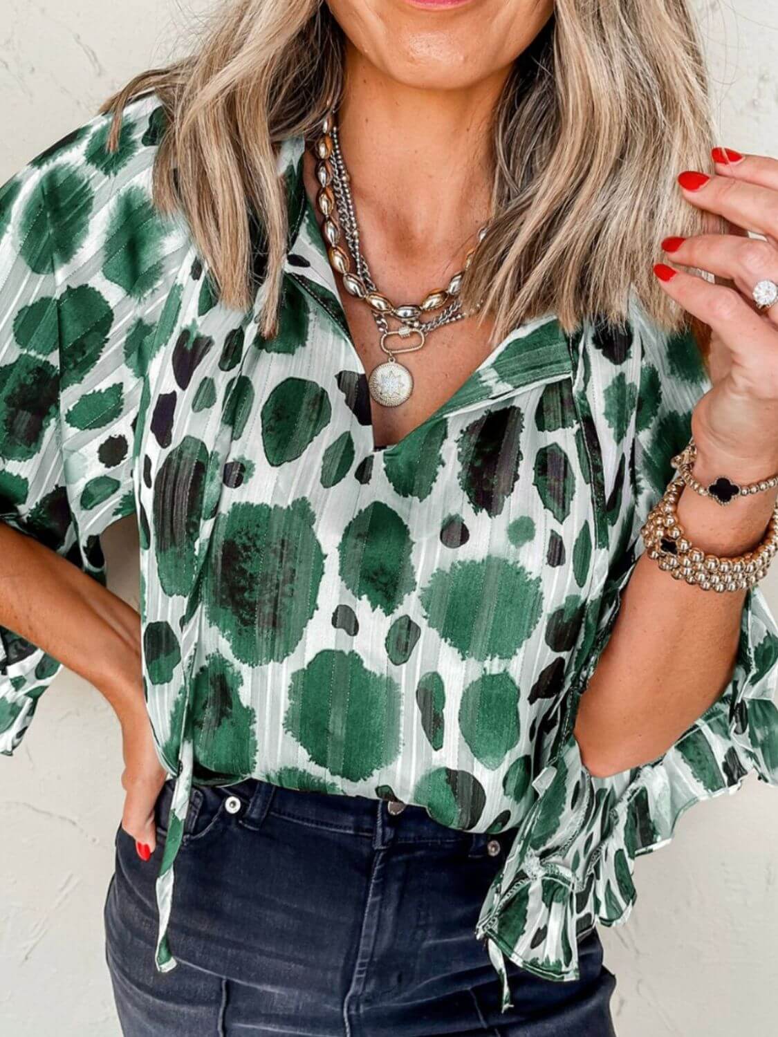 Printed tie neck three-quarter sleeve blouse with a stylish and feminine design, perfect for both casual and professional wear, available at 6i6.com