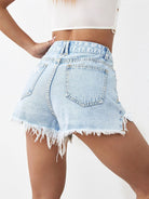 Distressed raw hem denim shorts with a frayed edge and a trendy, worn-in look, available at 6i6.com