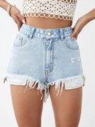 Distressed raw hem denim shorts with a frayed edge and a trendy, worn-in look, available at 6i6.com