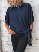 Knotted round neck half sleeve blouse with a trendy knot detail for a chic and casual look, available at 6i6.com