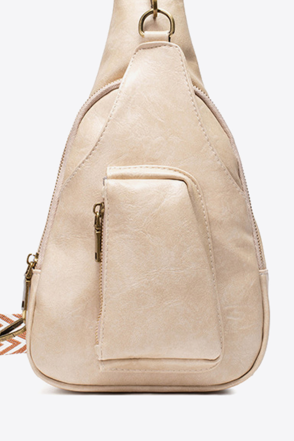 All The Feels PU leather sling bag featuring adjustable strap and front zipper pocket in cream color.