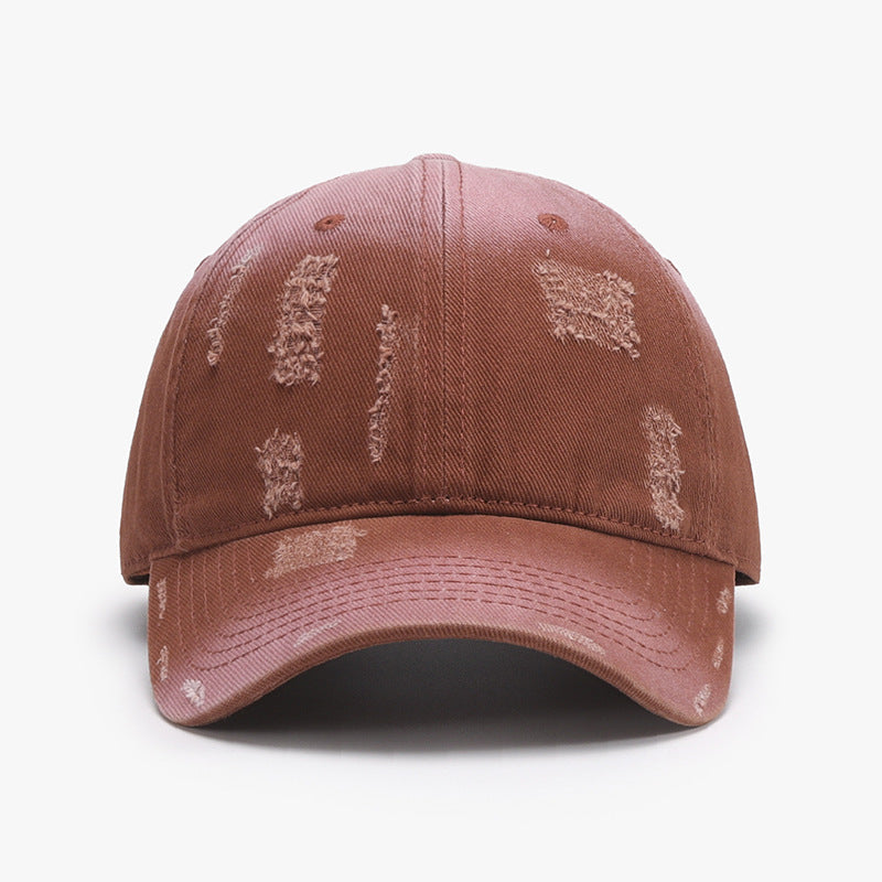 Adjustable cotton baseball hat in distressed brown finish, showcasing a relaxed fit and casual style.