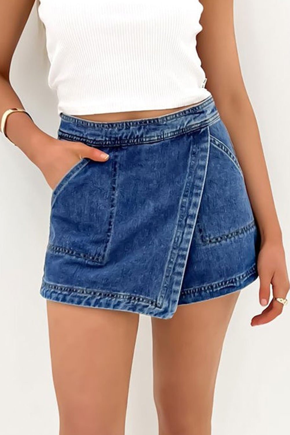 Ashleigh Blue Faux-Wrapped Mini Denim Skort for women from 6i6.com, a trendy and versatile summer piece.