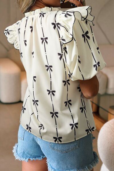 Bow Print Tie Neck Short Sleeve Blouse for women from 6i6.com, a stylish and versatile top for casual or office wear.