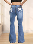 Bow back flare jeans with a feminine, playful design and a flattering fit, available at 6i6.com