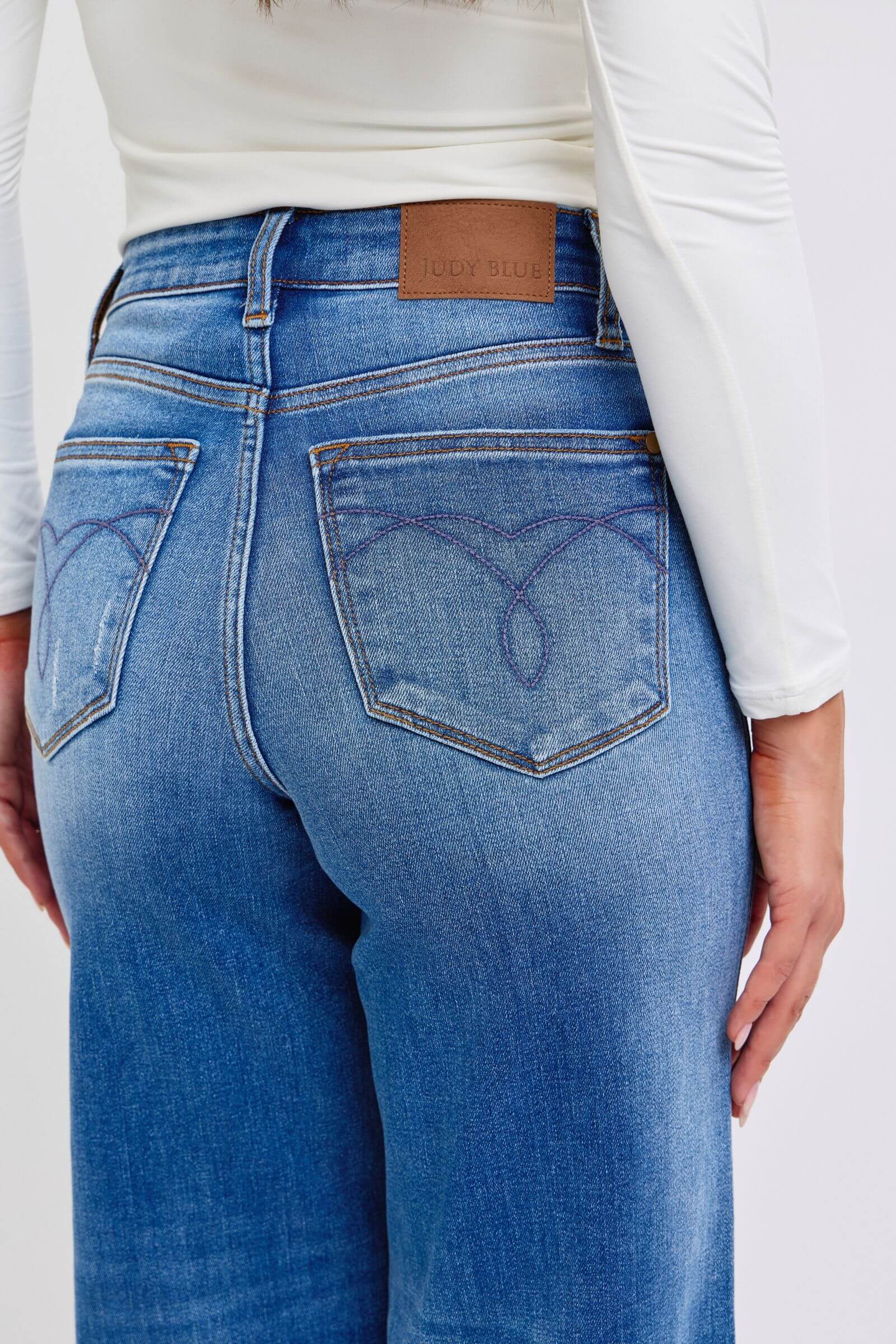 Judy Blue full-size distressed high waist wide leg jeans with a relaxed fit and stylish distressed details, available at 6i6.com