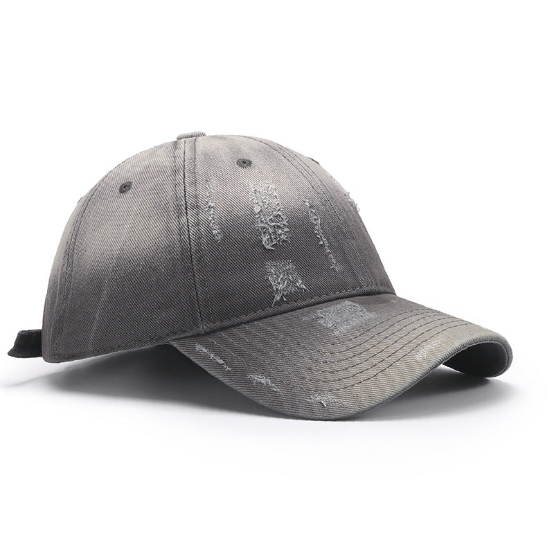 Adjustable cotton baseball hat in gray with a distressed look, perfect for casual wear and outdoor activities.