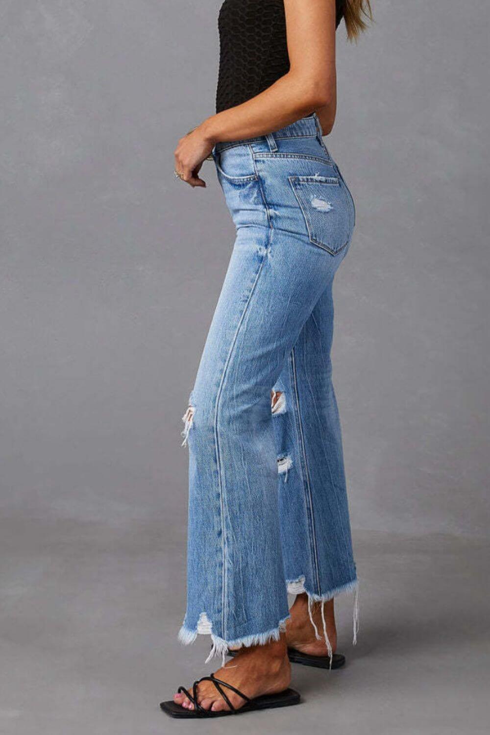 Distressed raw hem jeans with pockets, featuring a trendy frayed edge and a casual, stylish look, available at 6i6.com