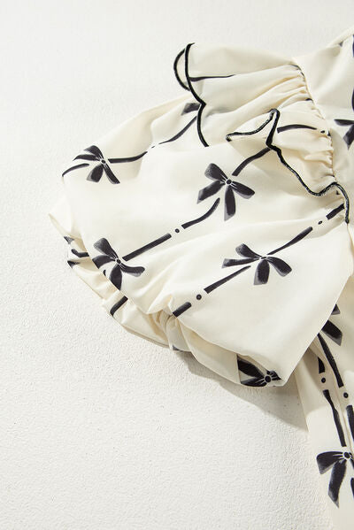 Bow Print Tie Neck Short Sleeve Blouse for women from 6i6.com, a stylish and versatile top for casual or office wear.