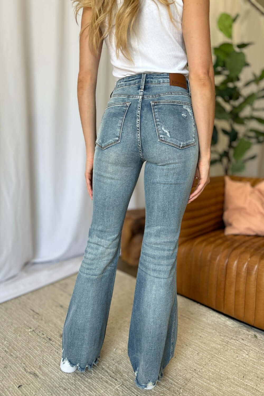 Judy Blue full-size medium rise tummy control destroy flare jeans with a flattering fit and distressed details, available at 6i6.com