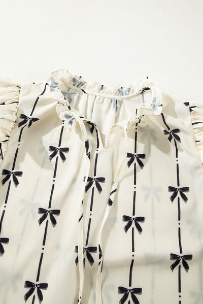 Bow Print Tie Neck Short Sleeve Blouse for women from 6i6.com, a stylish and versatile top for casual or office wear.