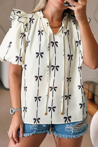 Bow Print Tie Neck Short Sleeve Blouse for women from 6i6.com, a stylish and versatile top for casual or office wear.