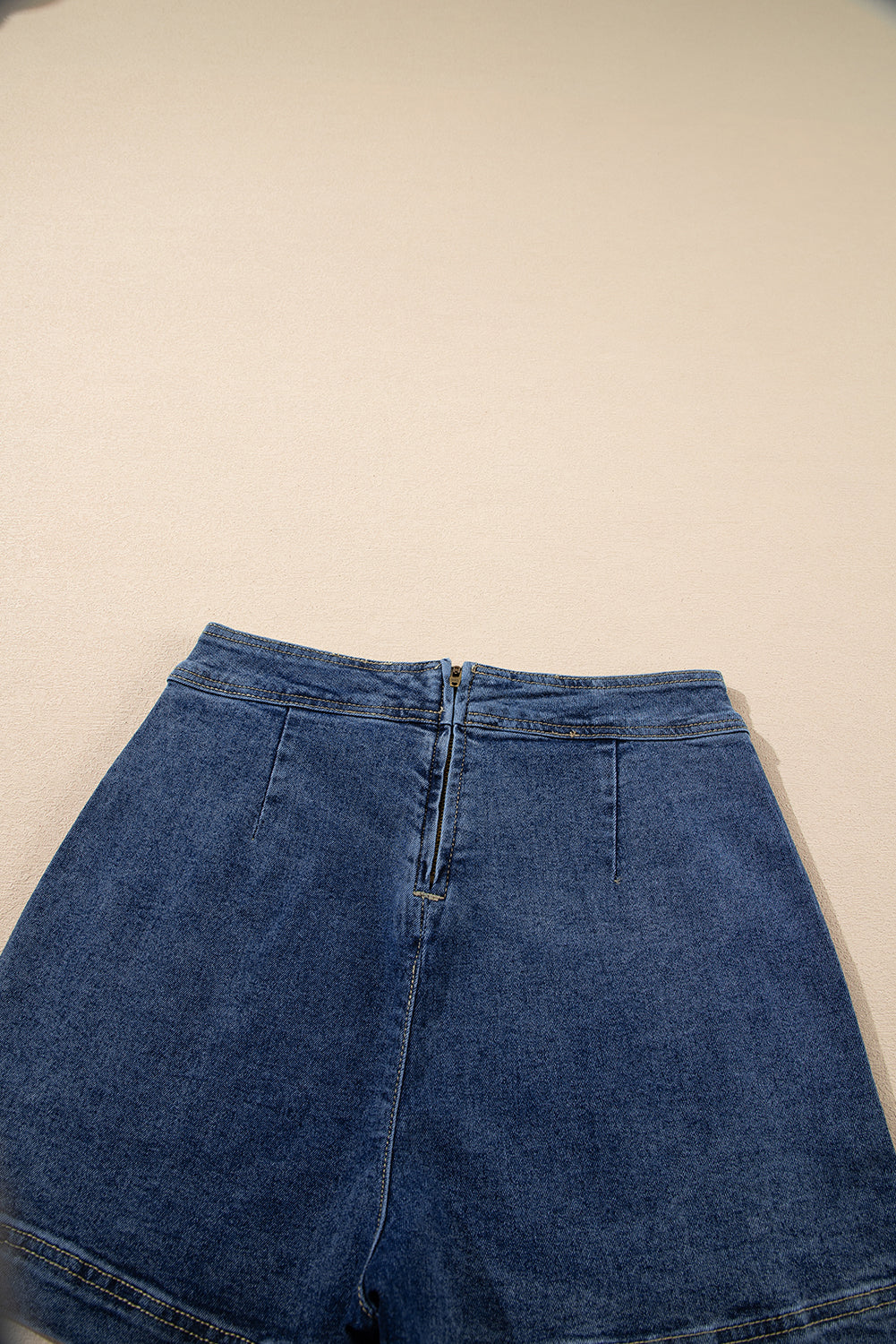 Ashleigh Blue Faux-Wrapped Mini Denim Skort for women from 6i6.com, a trendy and versatile summer piece.