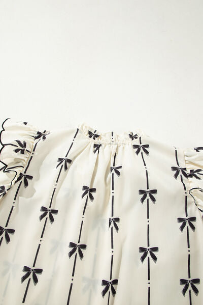 Bow Print Tie Neck Short Sleeve Blouse for women from 6i6.com, a stylish and versatile top for casual or office wear.