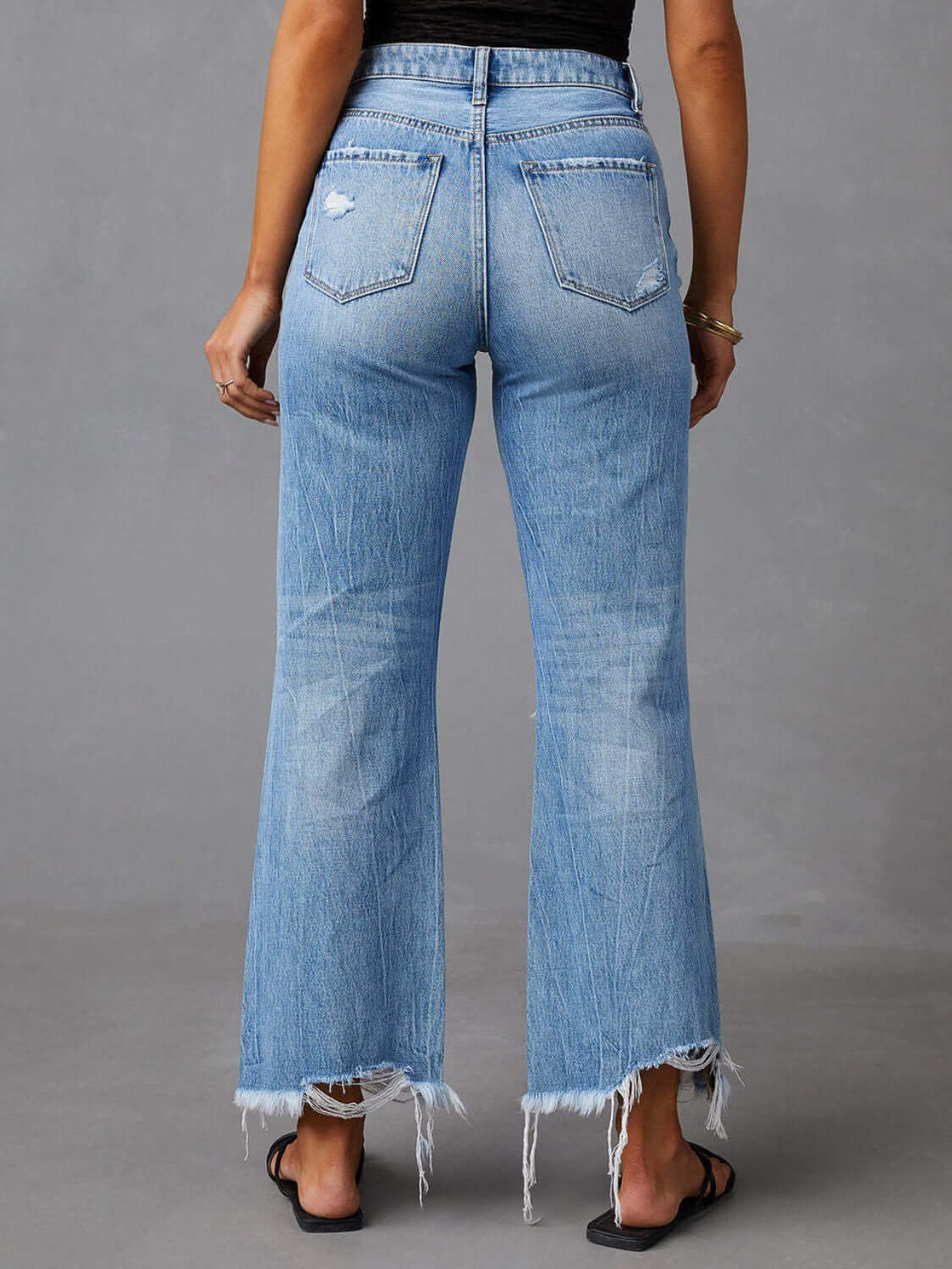 Distressed raw hem jeans with pockets, featuring a trendy frayed edge and a casual, stylish look, available at 6i6.com
